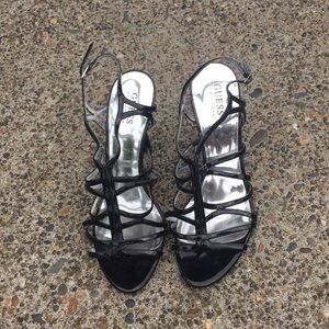 Black patent leather pumps- brand is Guess